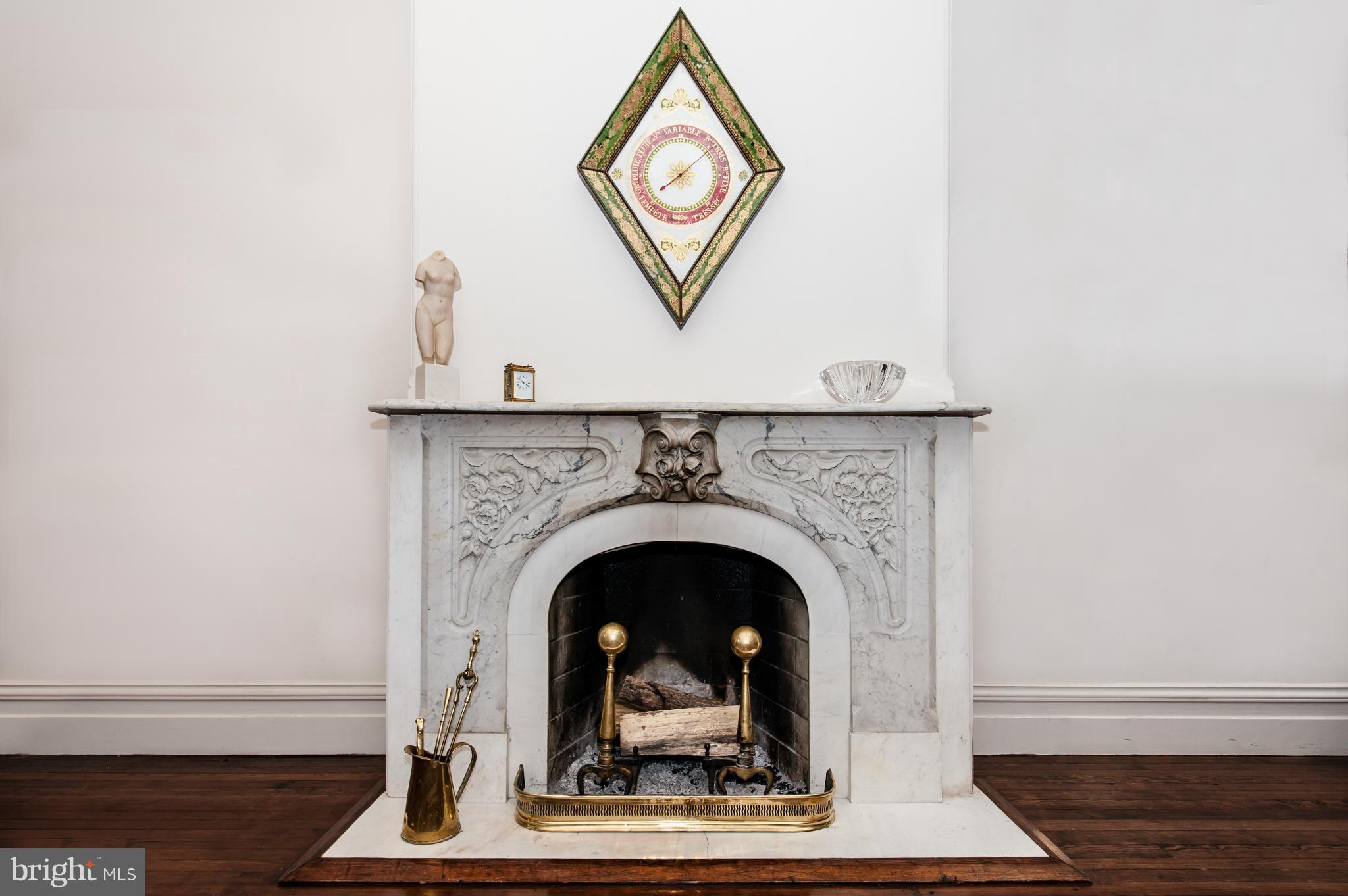 1318 Rhode Island Avenue Northwest Washington, DC 20005 - Photo 7 of 25 a living room with a fireplace and a rug