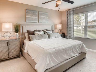 943 Riviera Avenue Sebastian, FL 32958 - Photo 5 of 10 a bedroom with a bed and a window