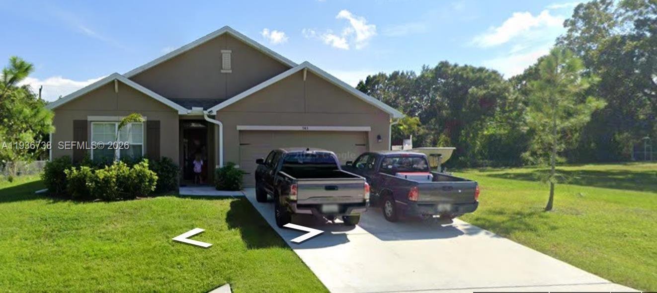 943 Riviera Avenue Sebastian, FL 32958 - Photo 9 of 10 a view of a house with backyard fire pit and couches