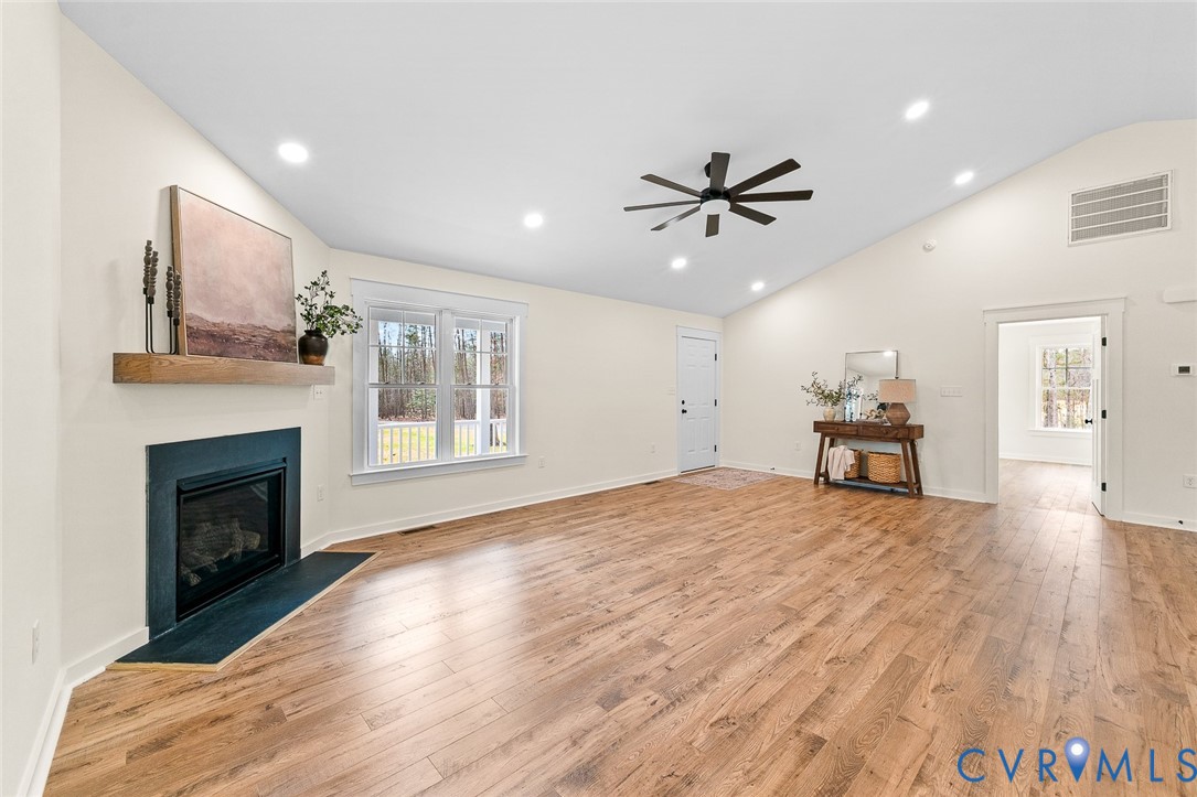 235 Bumpass Road Bumpass, VA 23024 - Photo 9 of 28 a view of an empty room with a fireplace and a window