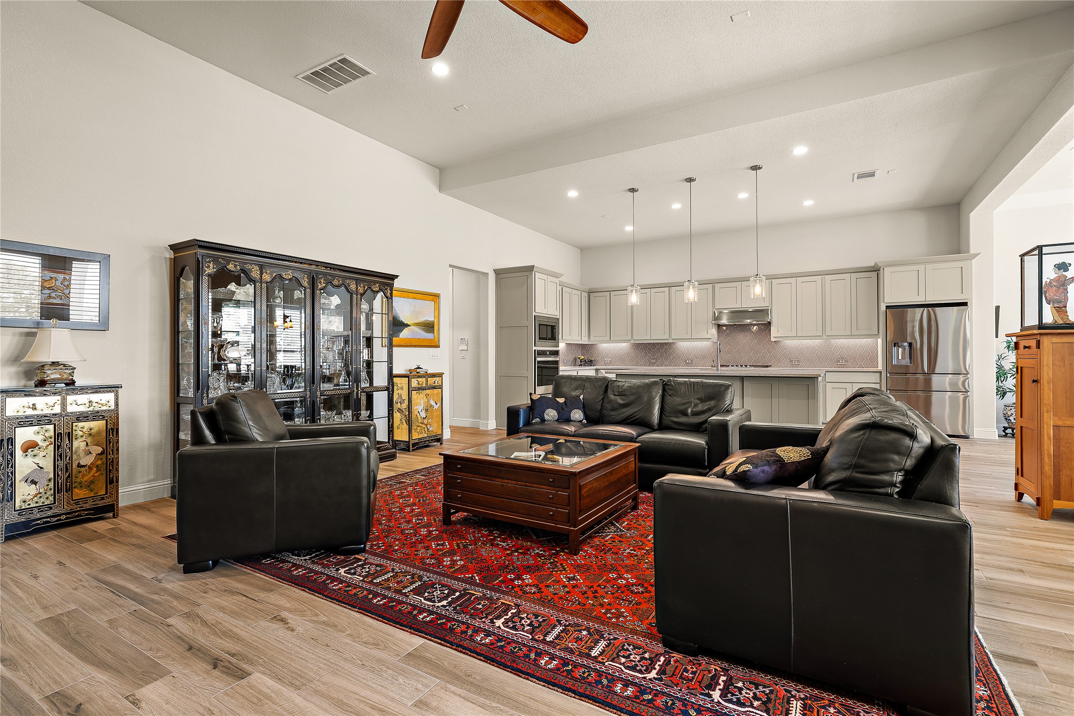1716 Siena Sunset Road Leander, TX 78641 - Photo 9 of 28 The living room, kitchen and dining come together in one big open space.