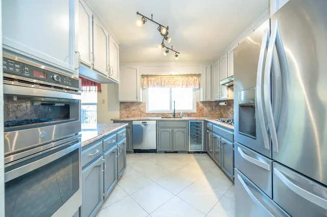 a view of a chairs and table on the wooden deck