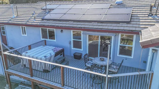 an empty room with wooden floor table and chair