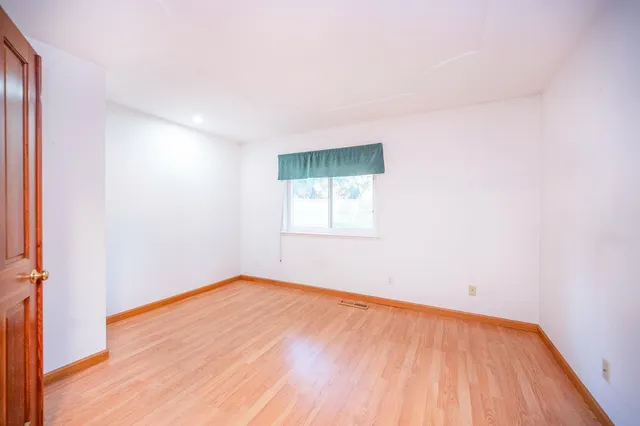 a bathroom with a sink toilet and a mirror
