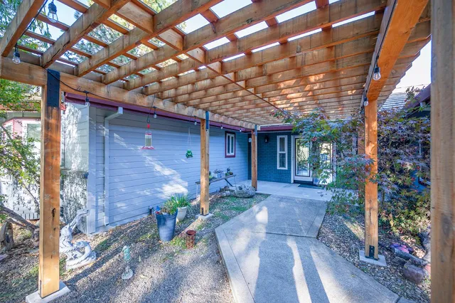 a view of kitchen with sink and wooden floor
