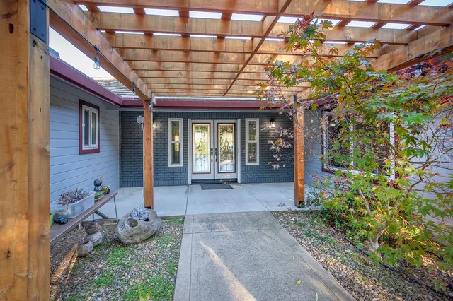 a kitchen with stainless steel appliances granite countertop a sink and a stove