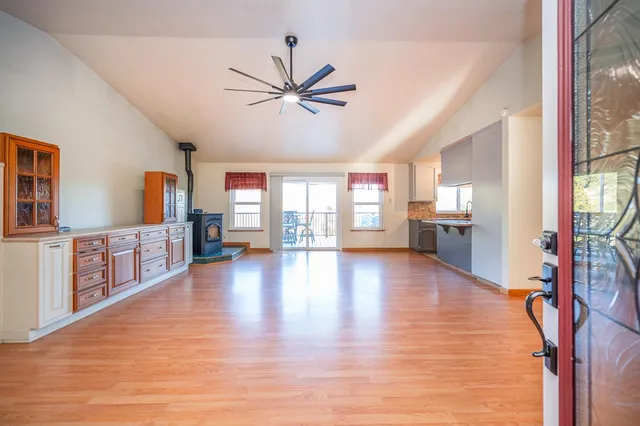 a kitchen with a sink cabinets and window