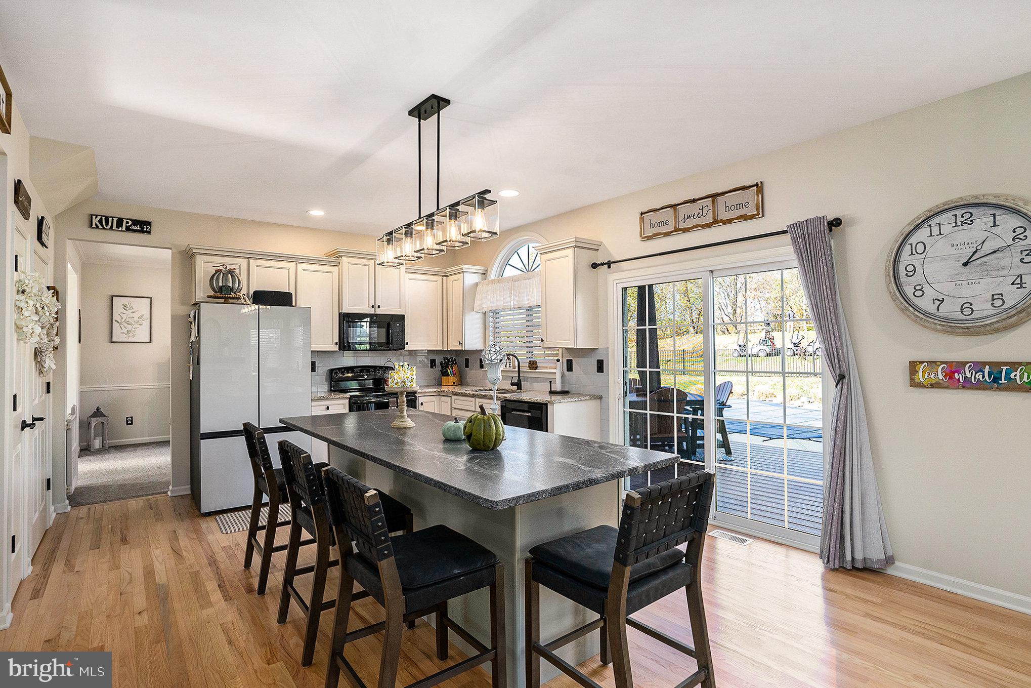 20 Bunker Way Pottstown, PA 19464 - Photo 15 of 45 a view of a dining room with furniture window and wooden floor