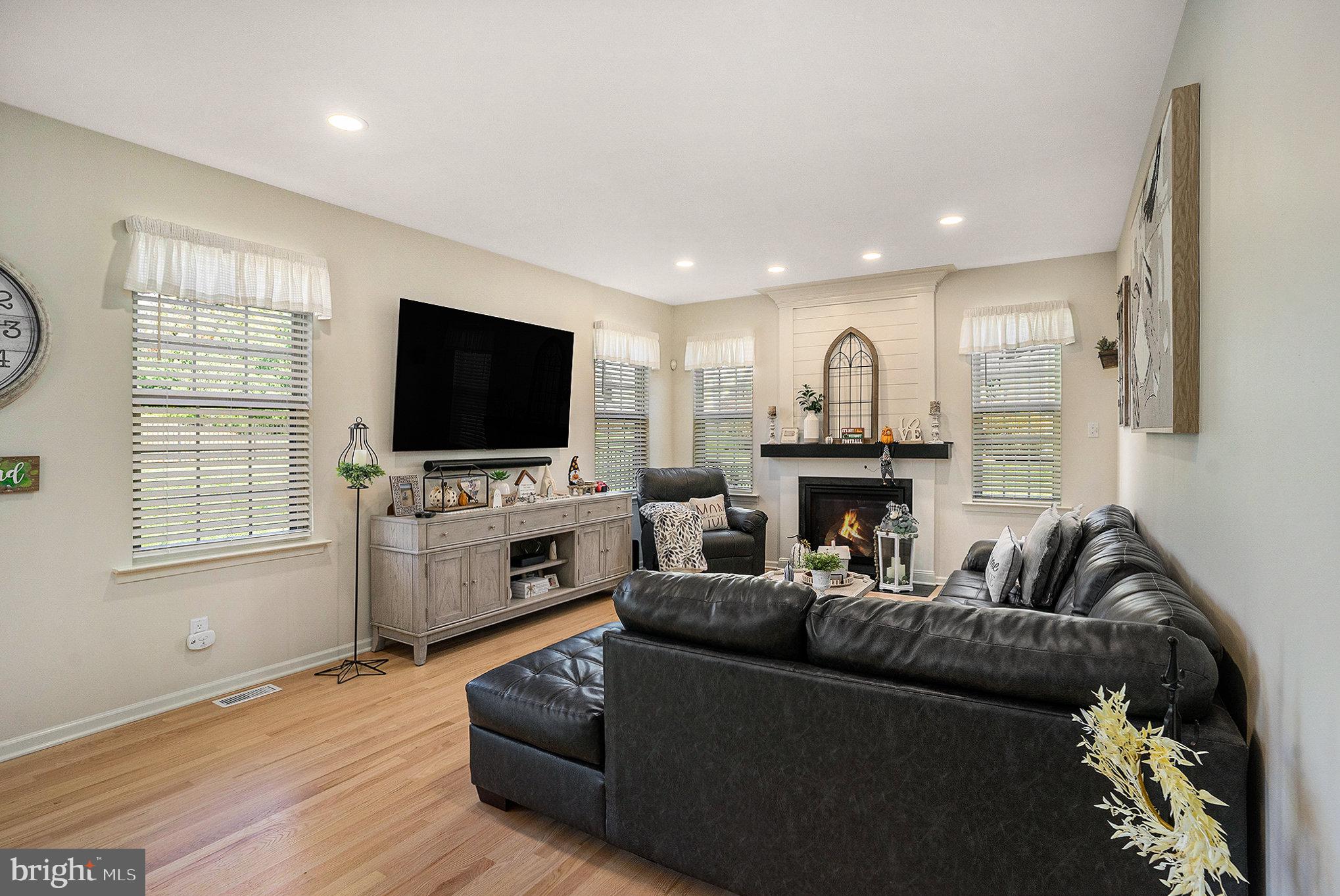 20 Bunker Way Pottstown, PA 19464 - Photo 17 of 45 a living room with furniture a fireplace and a flat screen tv