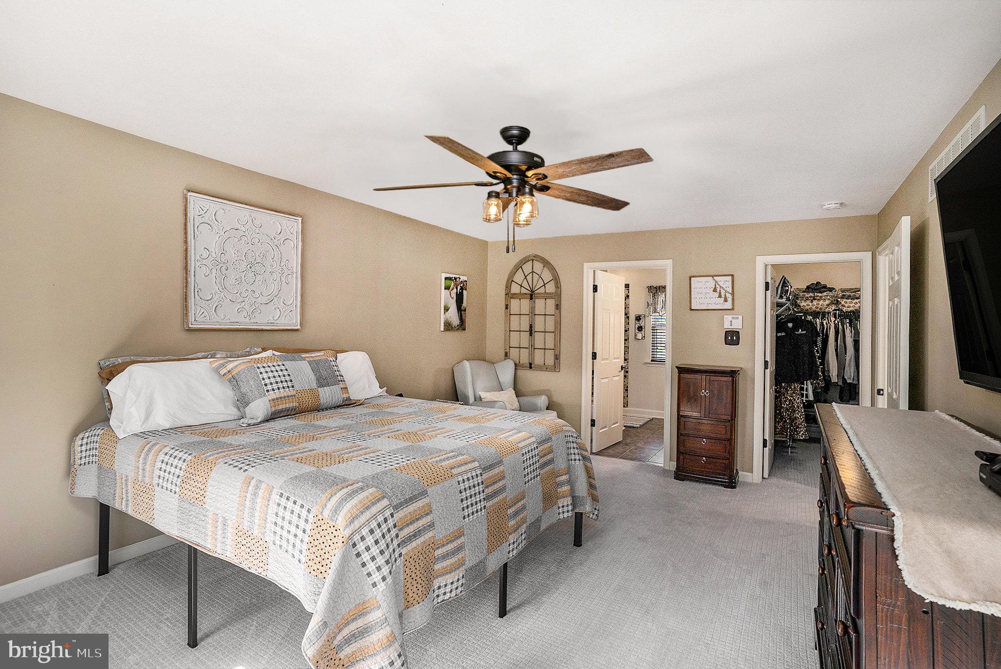 20 Bunker Way Pottstown, PA 19464 - Photo 24 of 45 a spacious bedroom with a bed and a chandelier