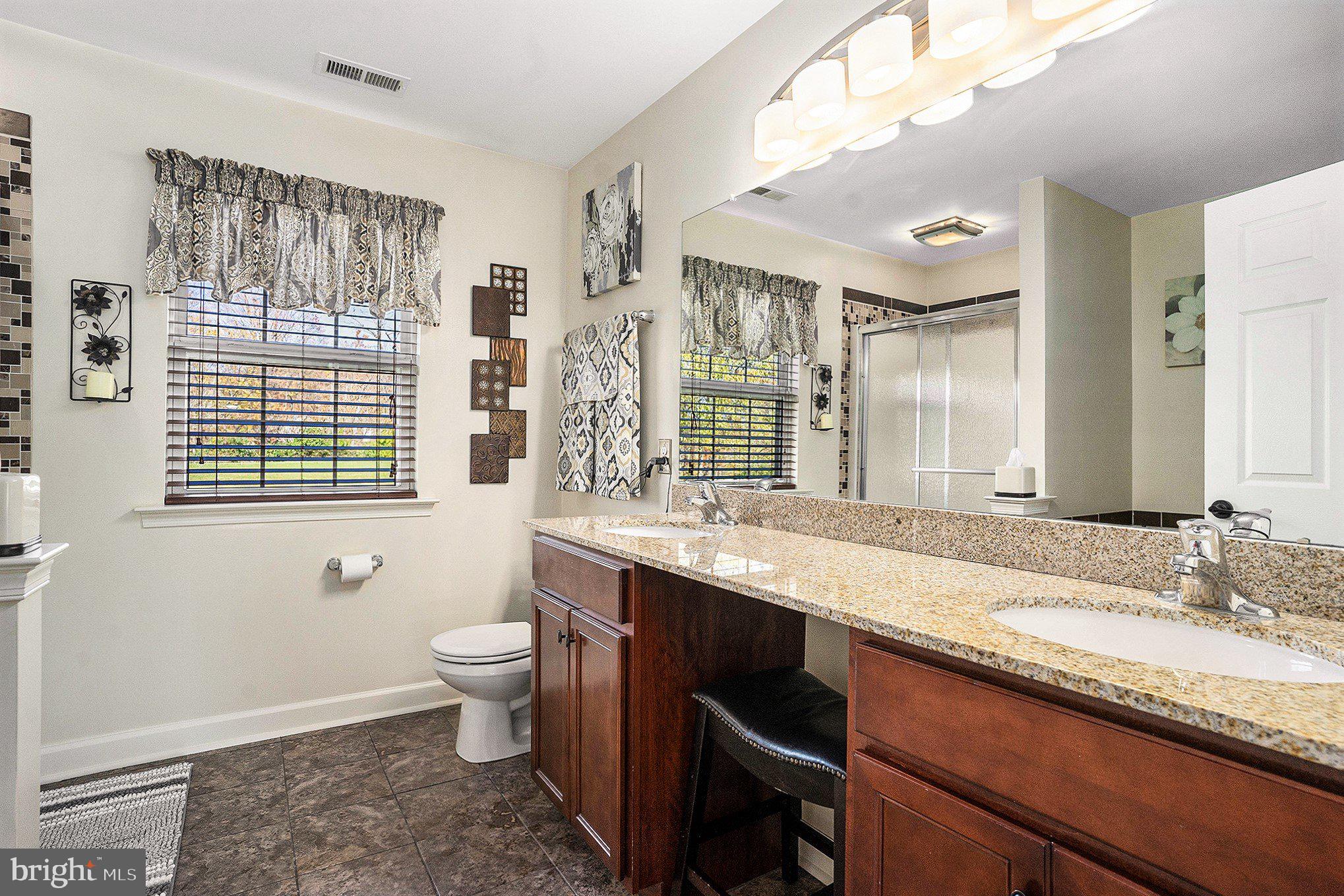 20 Bunker Way Pottstown, PA 19464 - Photo 26 of 45 a bathroom with a granite countertop sink and a large mirror
