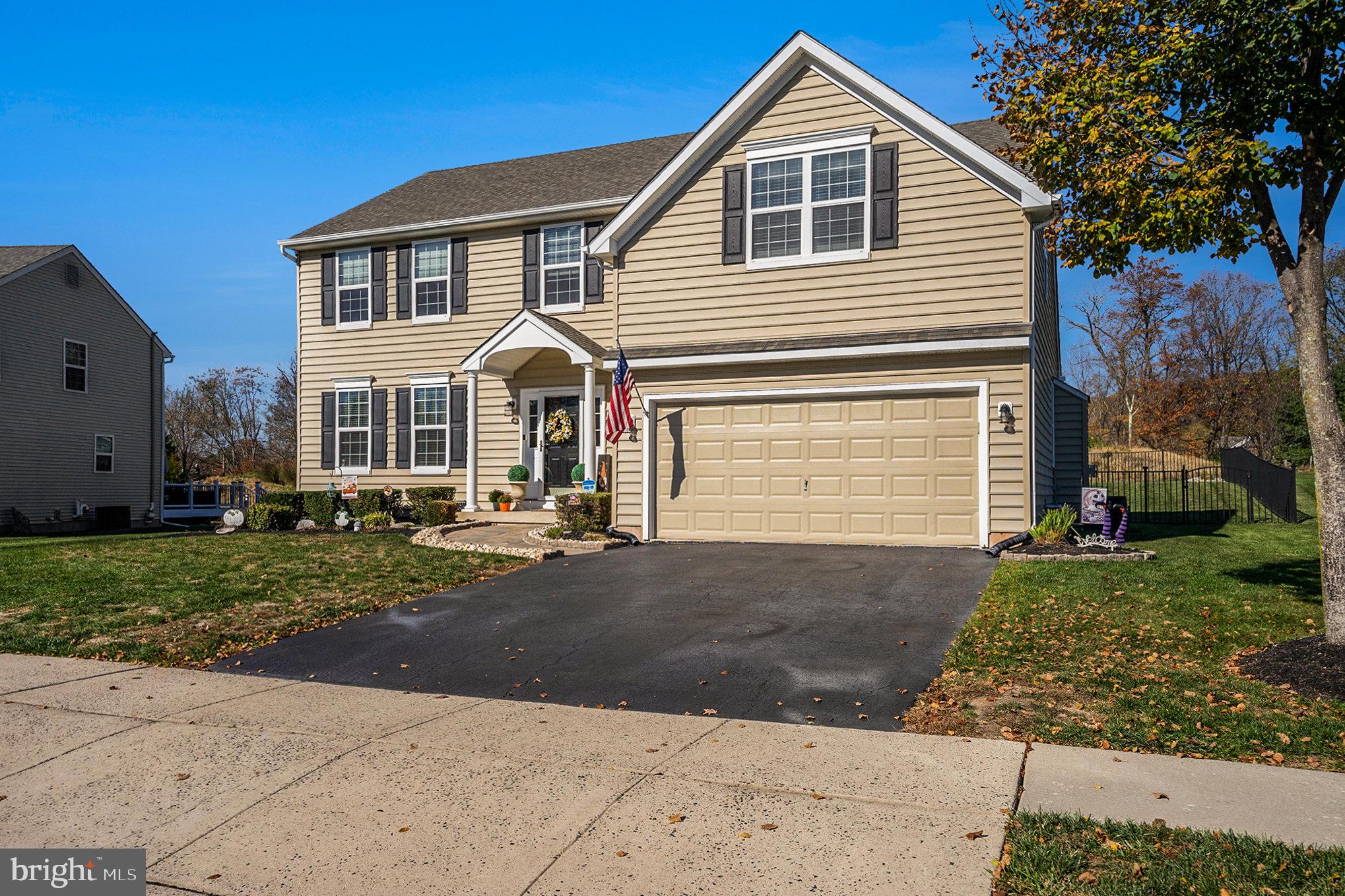20 Bunker Way Pottstown, PA 19464 - Photo 4 of 45 a front view of a house with a yard and garage
