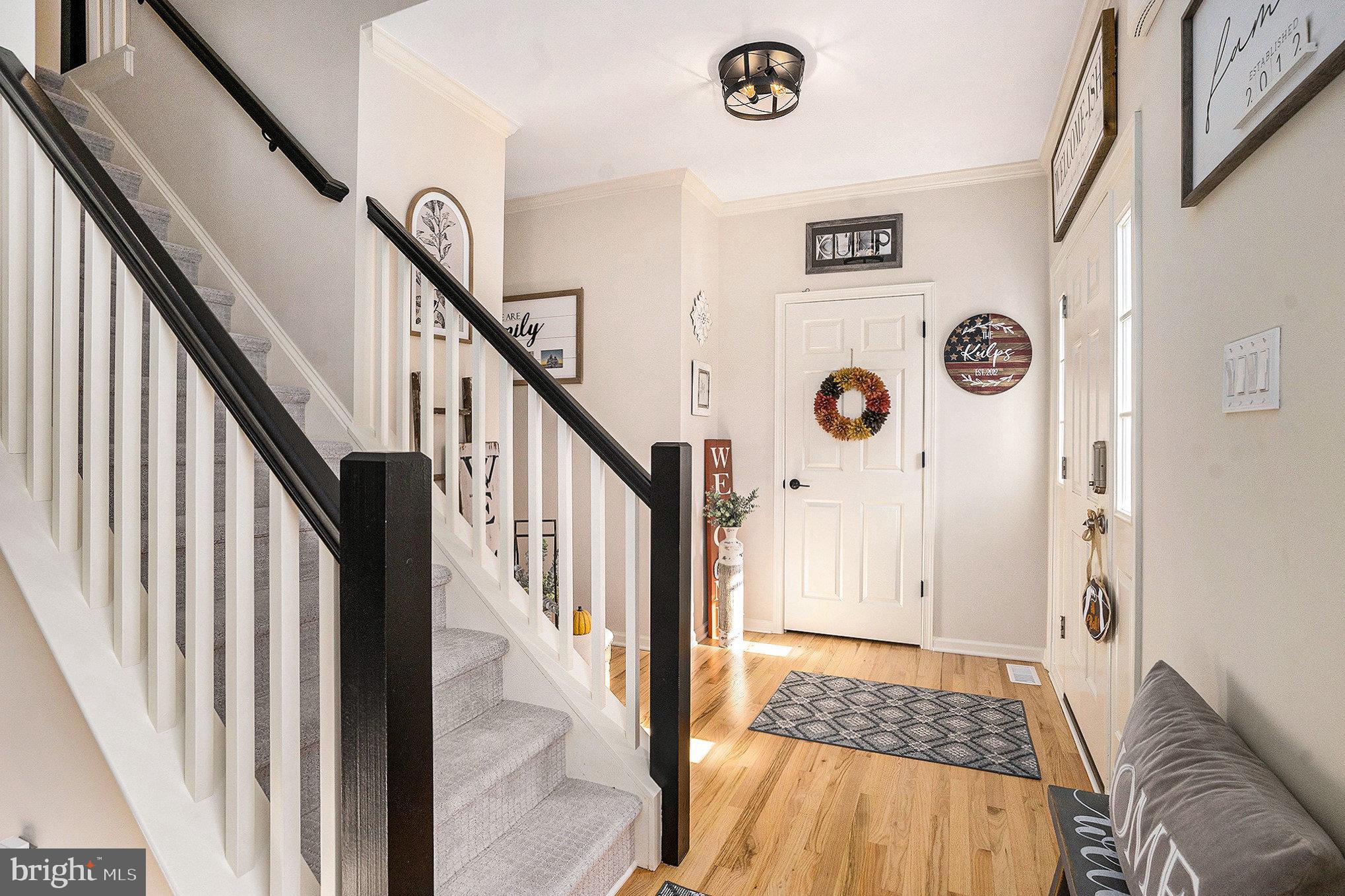 20 Bunker Way Pottstown, PA 19464 - Photo 6 of 45 a view of hallway with wooden floor and stairs
