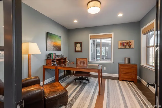 a view of a livingroom with furniture and a window