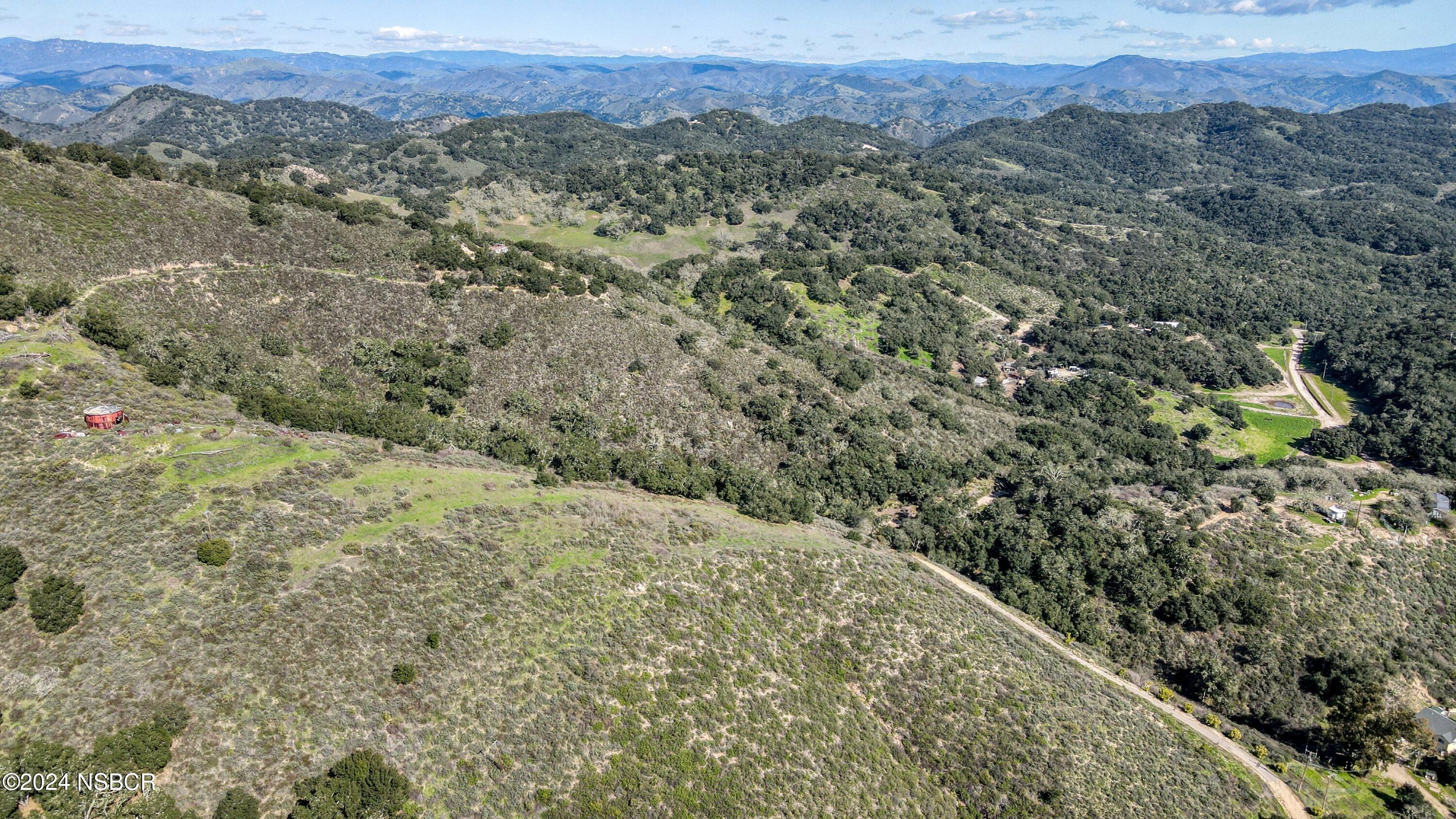 9339 Temettate Drive Santa Maria, CA 93454 - Photo 18 of 41 a view of a field with mountains in the background