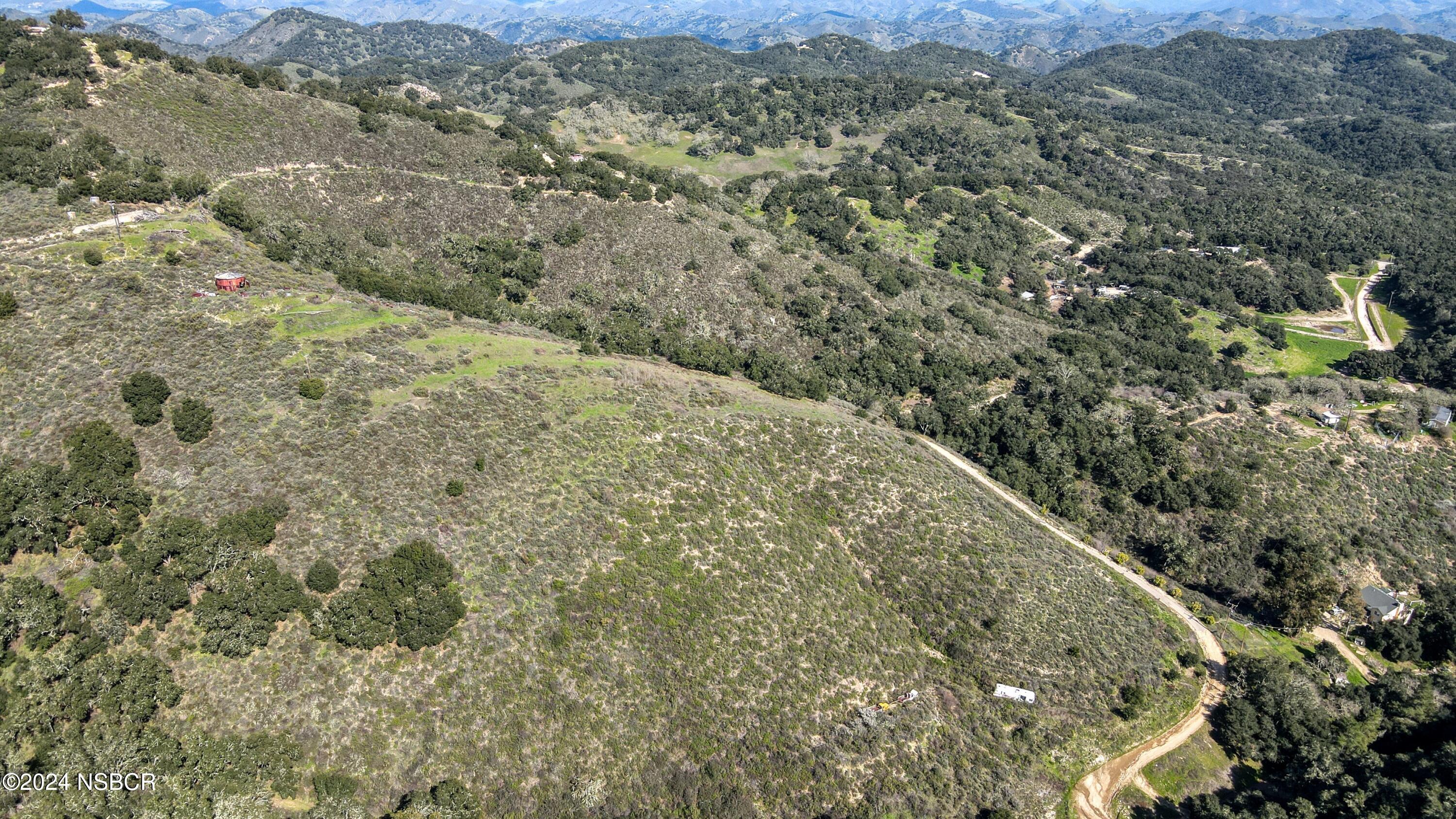9339 Temettate Drive Santa Maria, CA 93454 - Photo 19 of 41 a view of a dry yard with trees