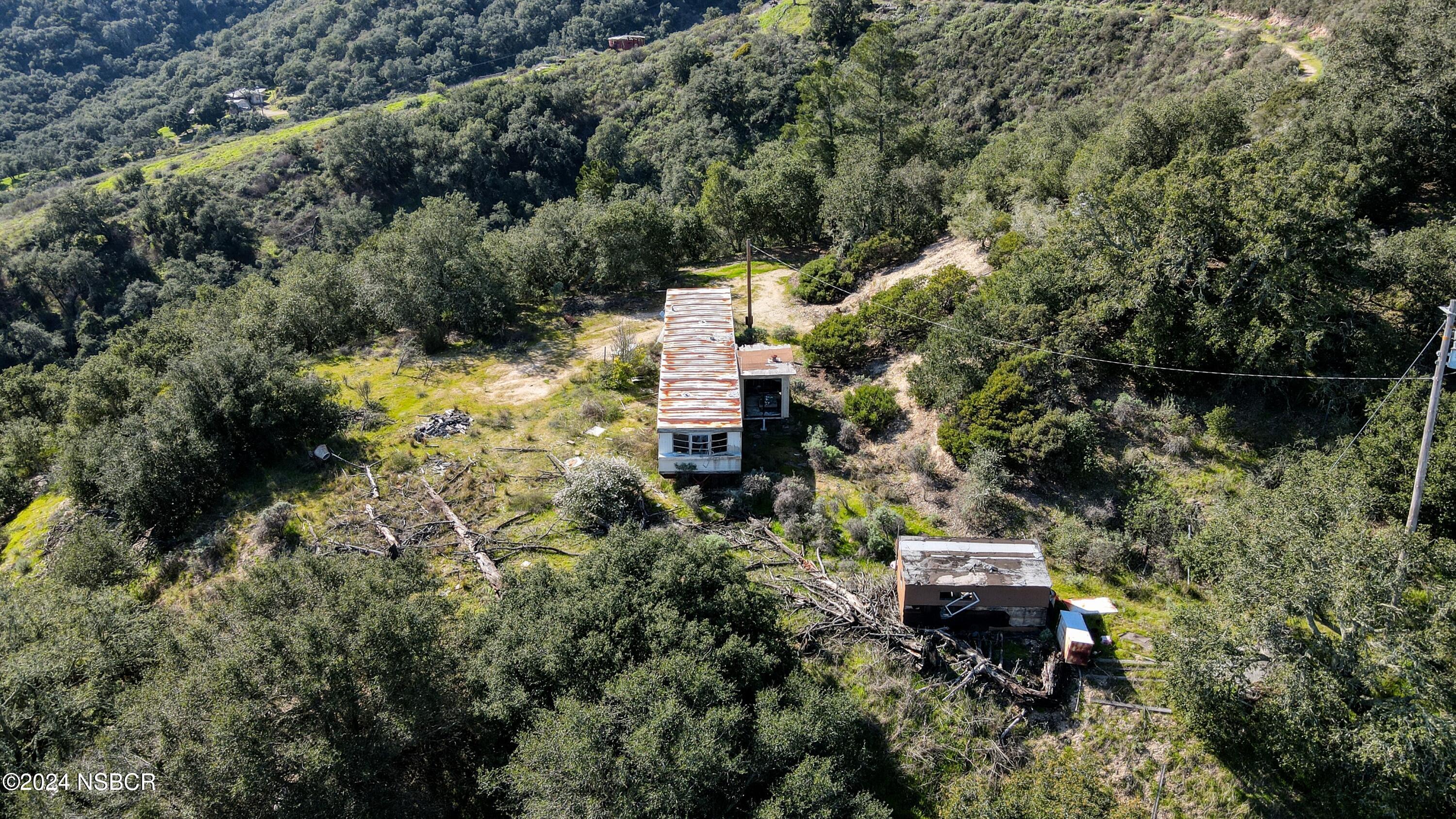 9339 Temettate Drive Santa Maria, CA 93454 - Photo 33 of 41 an aerial view of a house with a yard and wooden fence