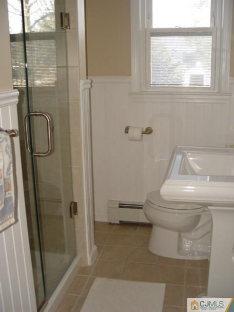 103 Wilson Road Somerset, NJ 08873 - Photo 11 of 14 a bathroom with a toilet and a shower