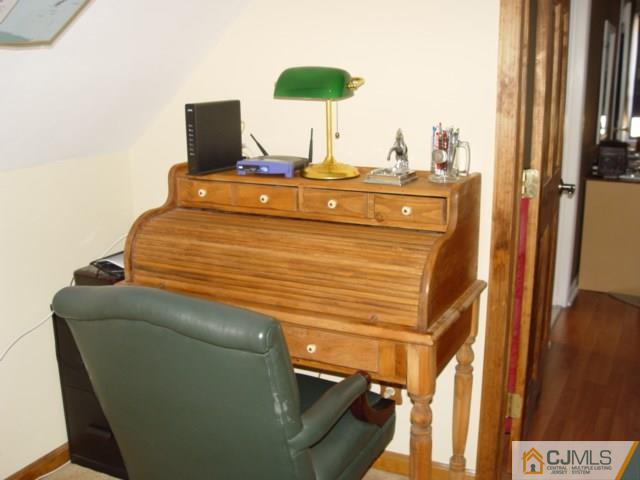 103 Wilson Road Somerset, NJ 08873 - Photo 7 of 14 a bed sitting in a bedroom next to a window