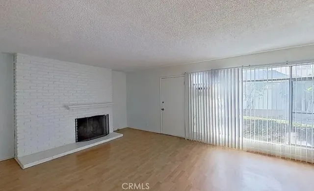 a kitchen with stainless steel appliances granite countertop a sink stove and white cabinets