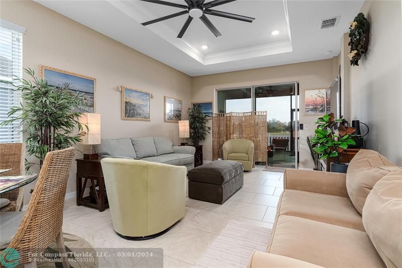 9857 Southwest 99th Loop Ocala, FL 34481 - Photo 16 of 45 a living room with furniture and a large window