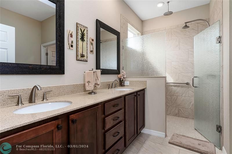 9857 Southwest 99th Loop Ocala, FL 34481 - Photo 21 of 45 a bathroom with a granite countertop sink mirror and double
