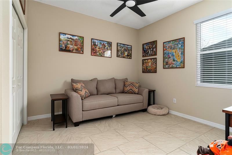 9857 Southwest 99th Loop Ocala, FL 34481 - Photo 22 of 45 a living room with furniture and a window