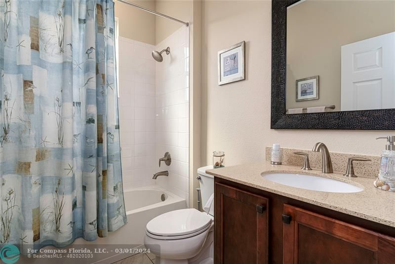 9857 Southwest 99th Loop Ocala, FL 34481 - Photo 23 of 45 a bathroom with a granite countertop sink toilet and shower