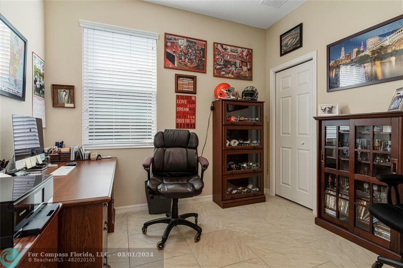 9857 Southwest 99th Loop Ocala, FL 34481 - Photo 24 of 45 a view of a workspace with furniture and cabinet