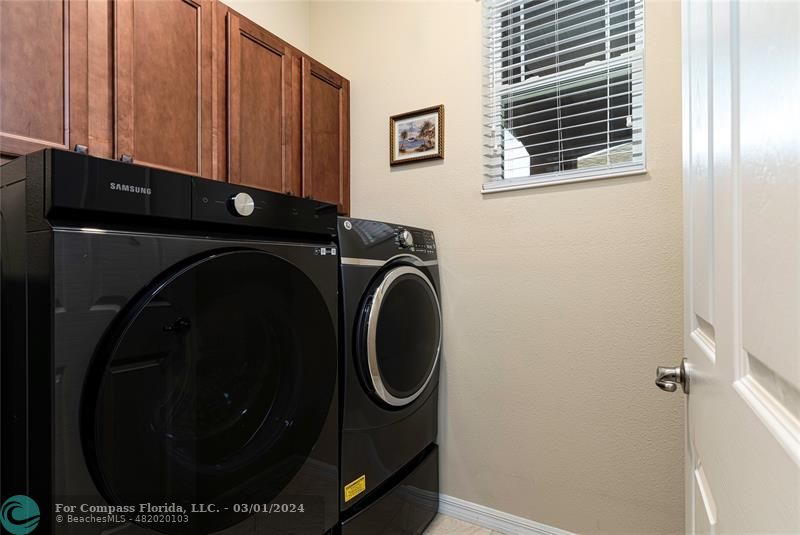 9857 Southwest 99th Loop Ocala, FL 34481 - Photo 25 of 45 a utility room with dryer and washer