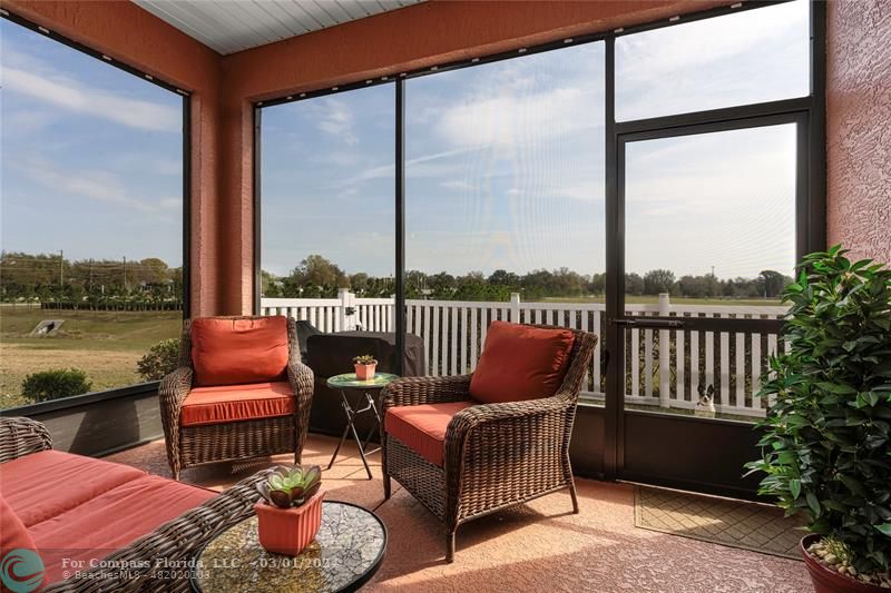 9857 Southwest 99th Loop Ocala, FL 34481 - Photo 26 of 45 a balcony with furniture and water view