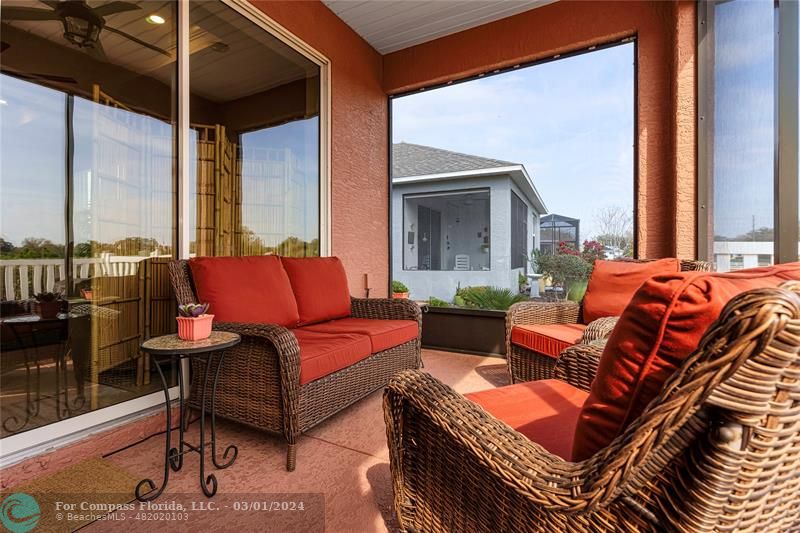 9857 Southwest 99th Loop Ocala, FL 34481 - Photo 27 of 45 a outdoor living space with furniture and a fireplace