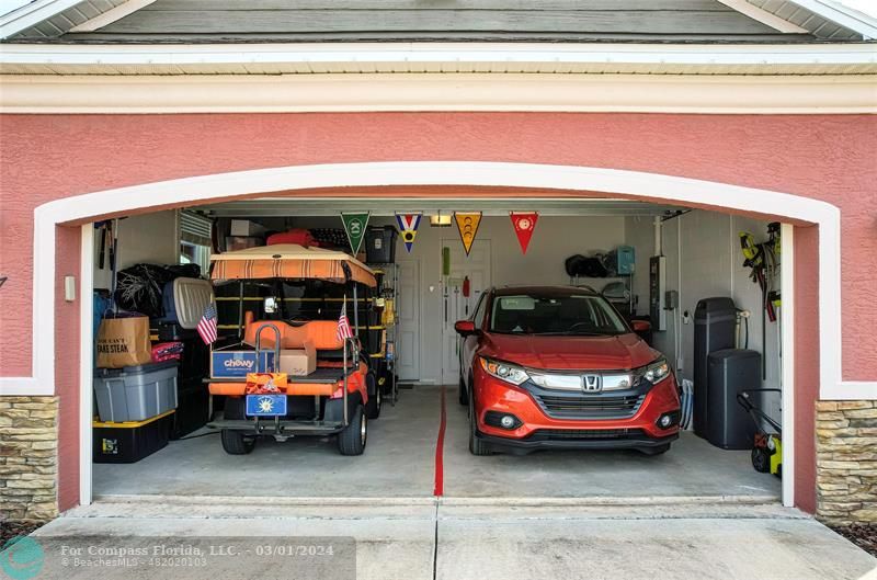 9857 Southwest 99th Loop Ocala, FL 34481 - Photo 28 of 45 a car parked in front of a building