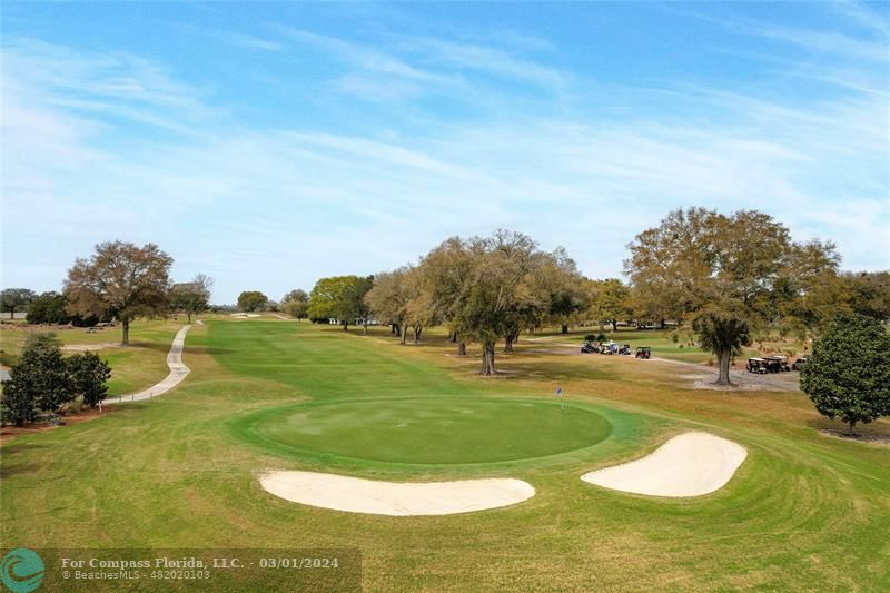9857 Southwest 99th Loop Ocala, FL 34481 - Photo 31 of 45 a swimming pool with outdoor seating and yard