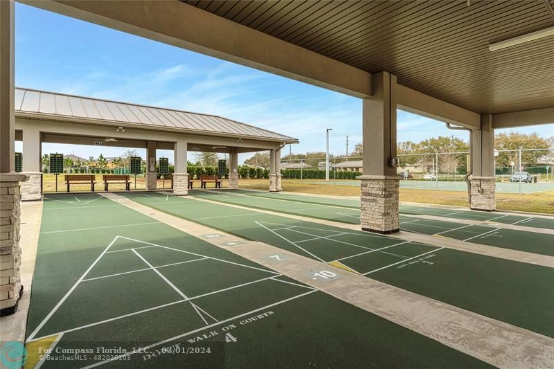 9857 Southwest 99th Loop Ocala, FL 34481 - Photo 34 of 45 a tennis court with view of main door