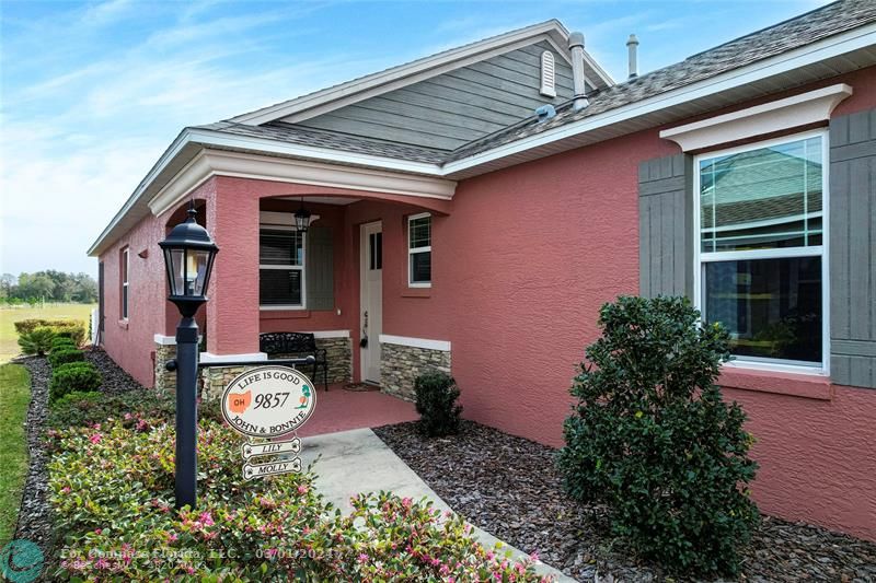 9857 Southwest 99th Loop Ocala, FL 34481 - Photo 8 of 45 a view of a house with a yard