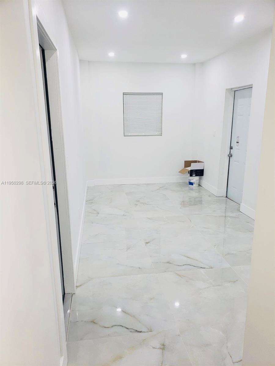 270 Northeast 162nd Street, Unit B Miami, FL 33162 - Photo 3 of 7 a view of an empty room