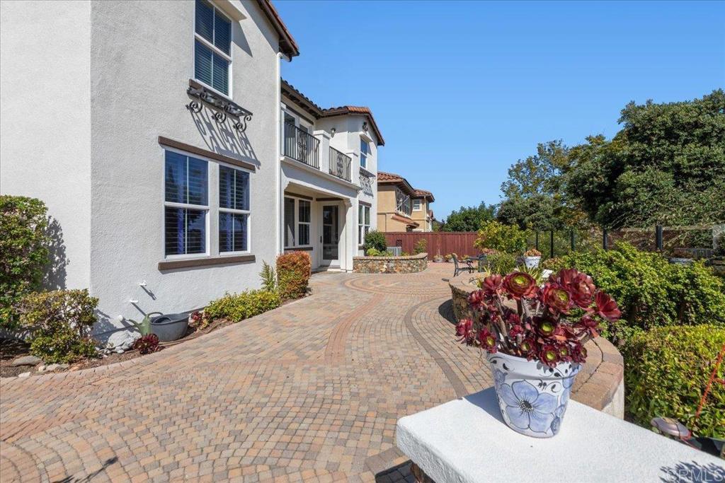 838 Luminara Way San Marcos, CA 92078 - Photo 51 of 54 a front view of a house with a yard and fountain