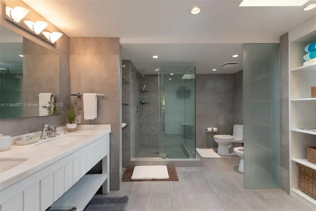 a bathroom with a sink vanity and mirror