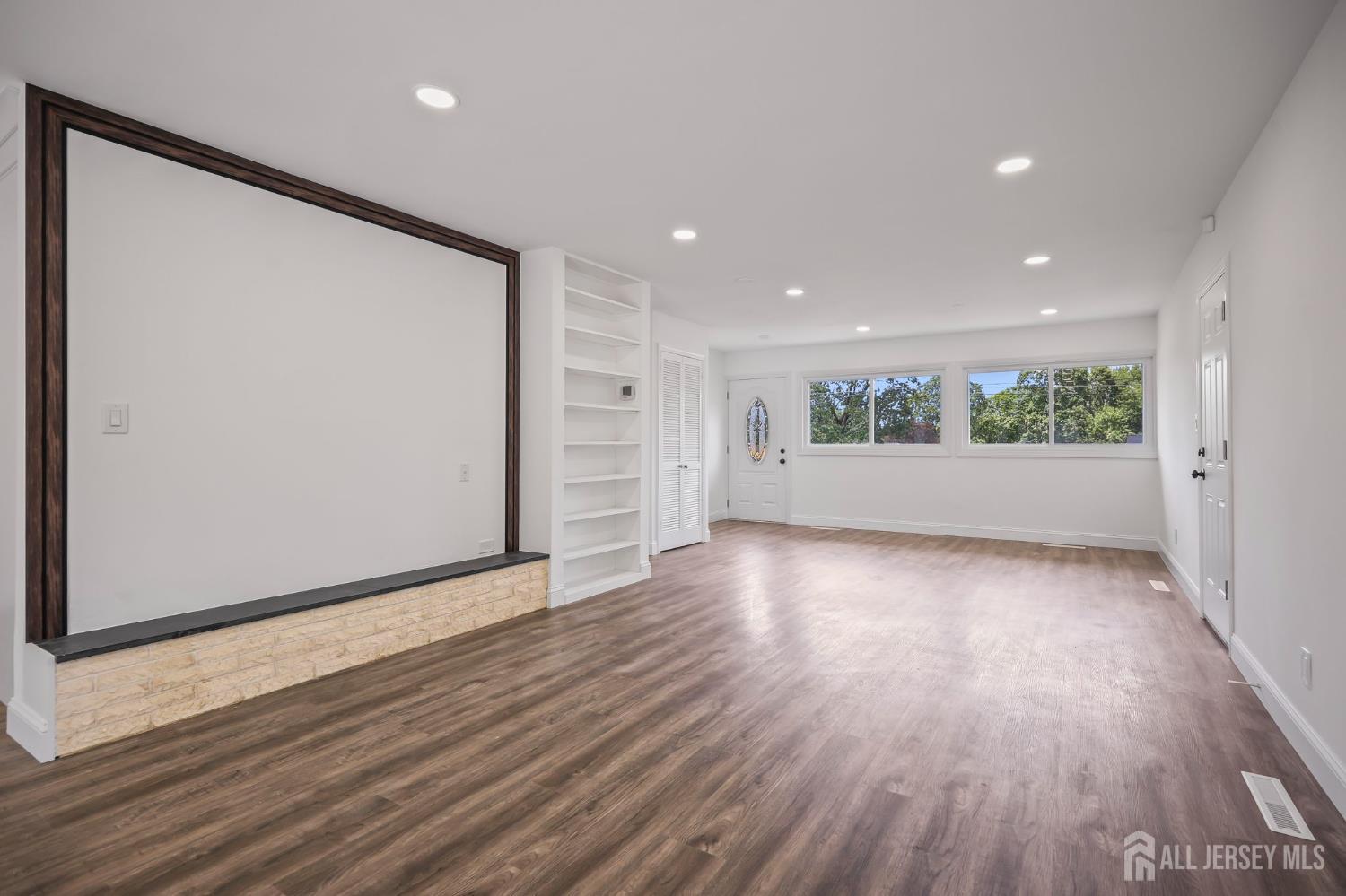 12 Dillon Road Kendall Park, NJ 08824 - Photo 13 of 48 an empty room with wooden floor and windows