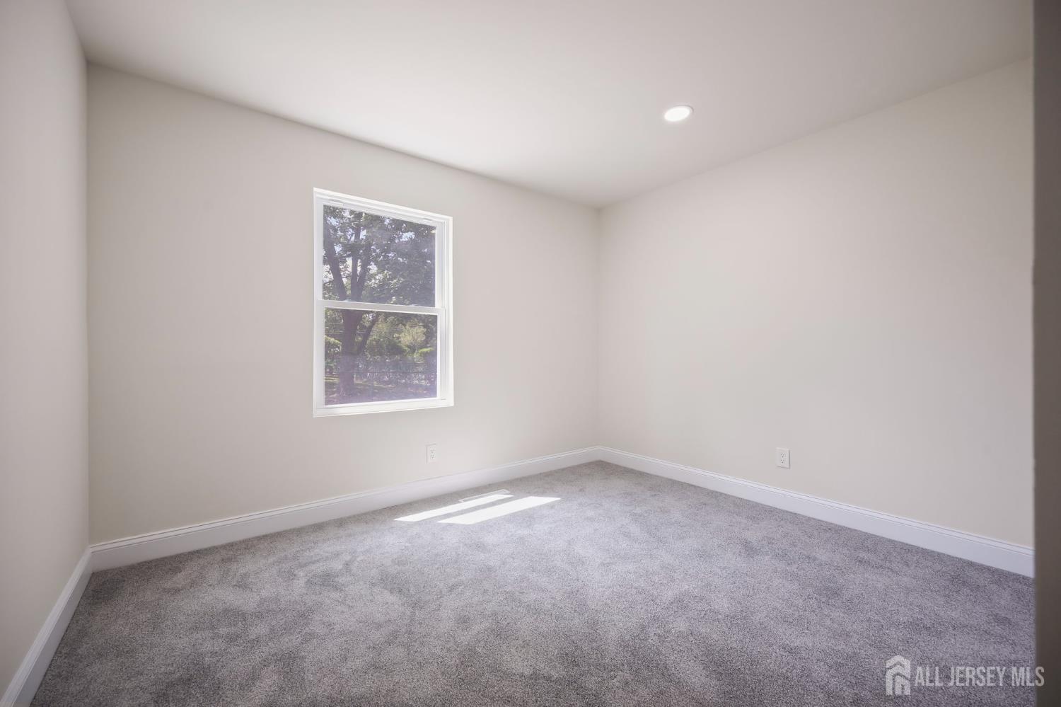12 Dillon Road Kendall Park, NJ 08824 - Photo 24 of 48 an empty room with a window