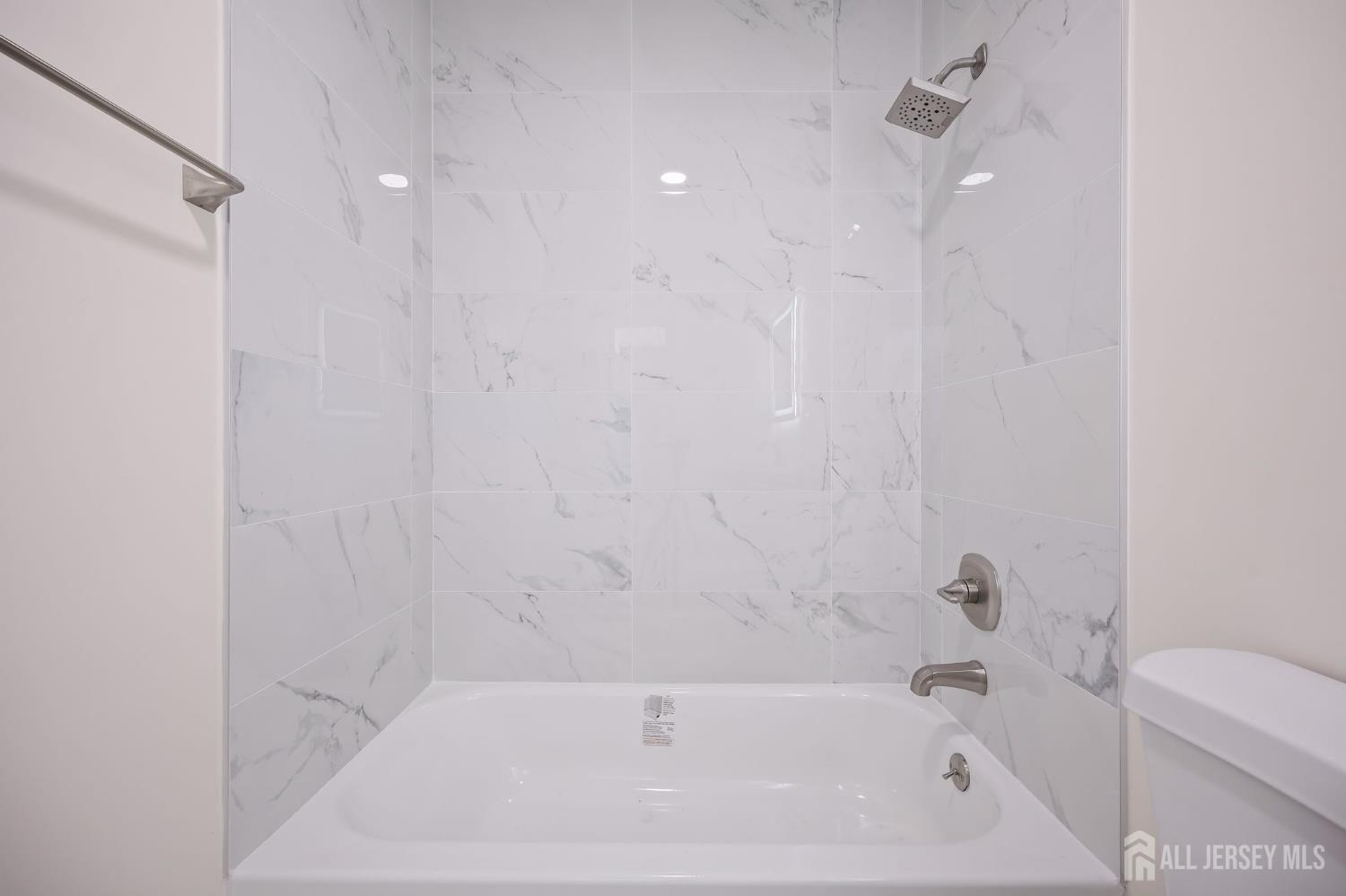 12 Dillon Road Kendall Park, NJ 08824 - Photo 27 of 48 a bathroom with a bathtub