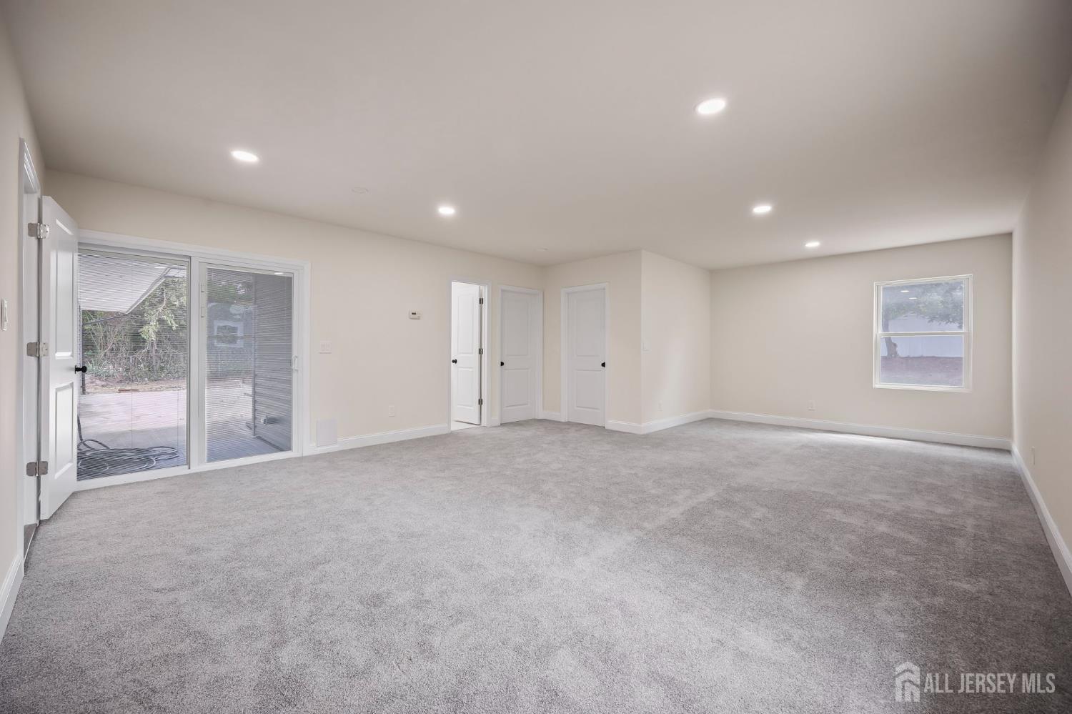 12 Dillon Road Kendall Park, NJ 08824 - Photo 29 of 48 a view of an empty room with glass door