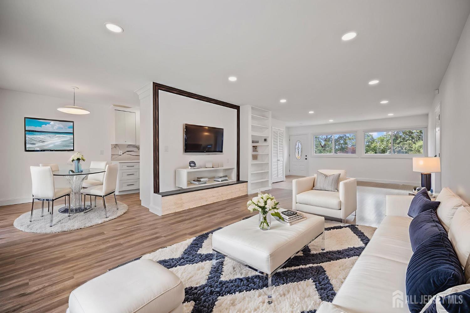 12 Dillon Road Kendall Park, NJ 08824 - Photo 3 of 48 a living room with furniture and a flat screen tv