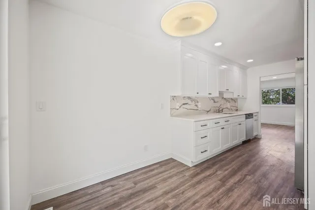 a room with a white cabinets and sink