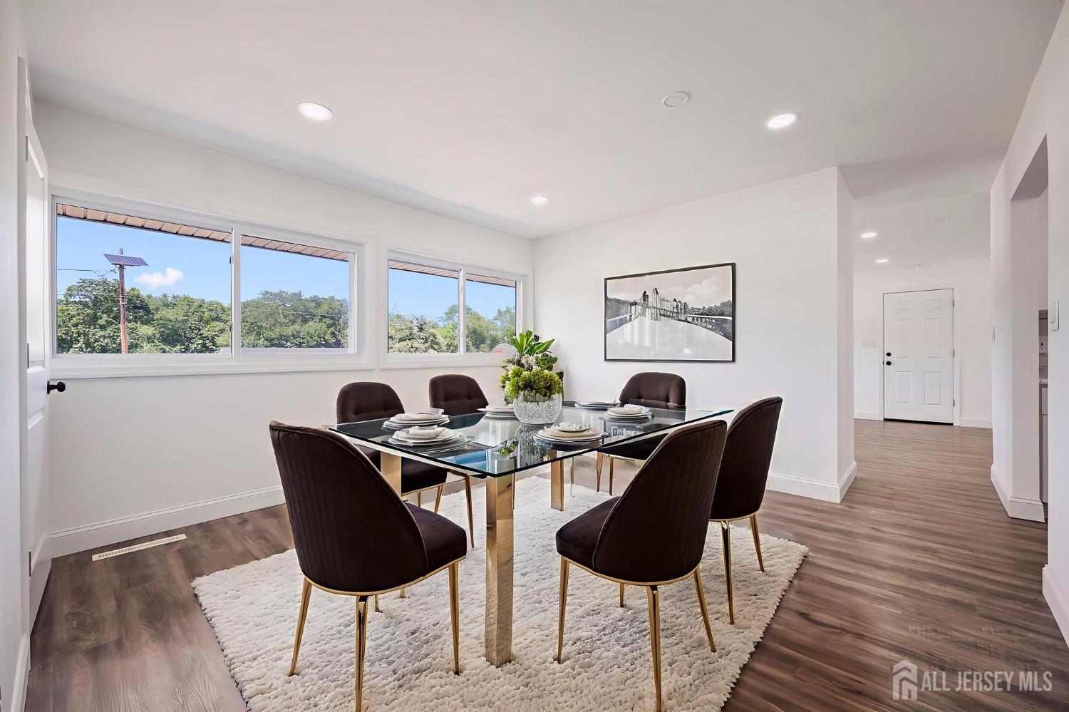 12 Dillon Road Kendall Park, NJ 08824 - Photo 4 of 48 a dining room with furniture and a large window