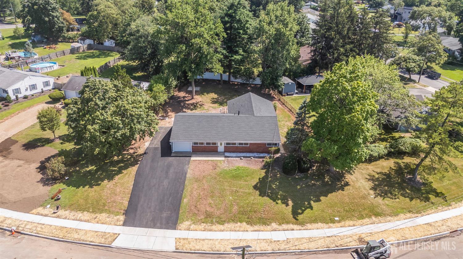 12 Dillon Road Kendall Park, NJ 08824 - Photo 44 of 48 a view of a house with a yard and sitting area