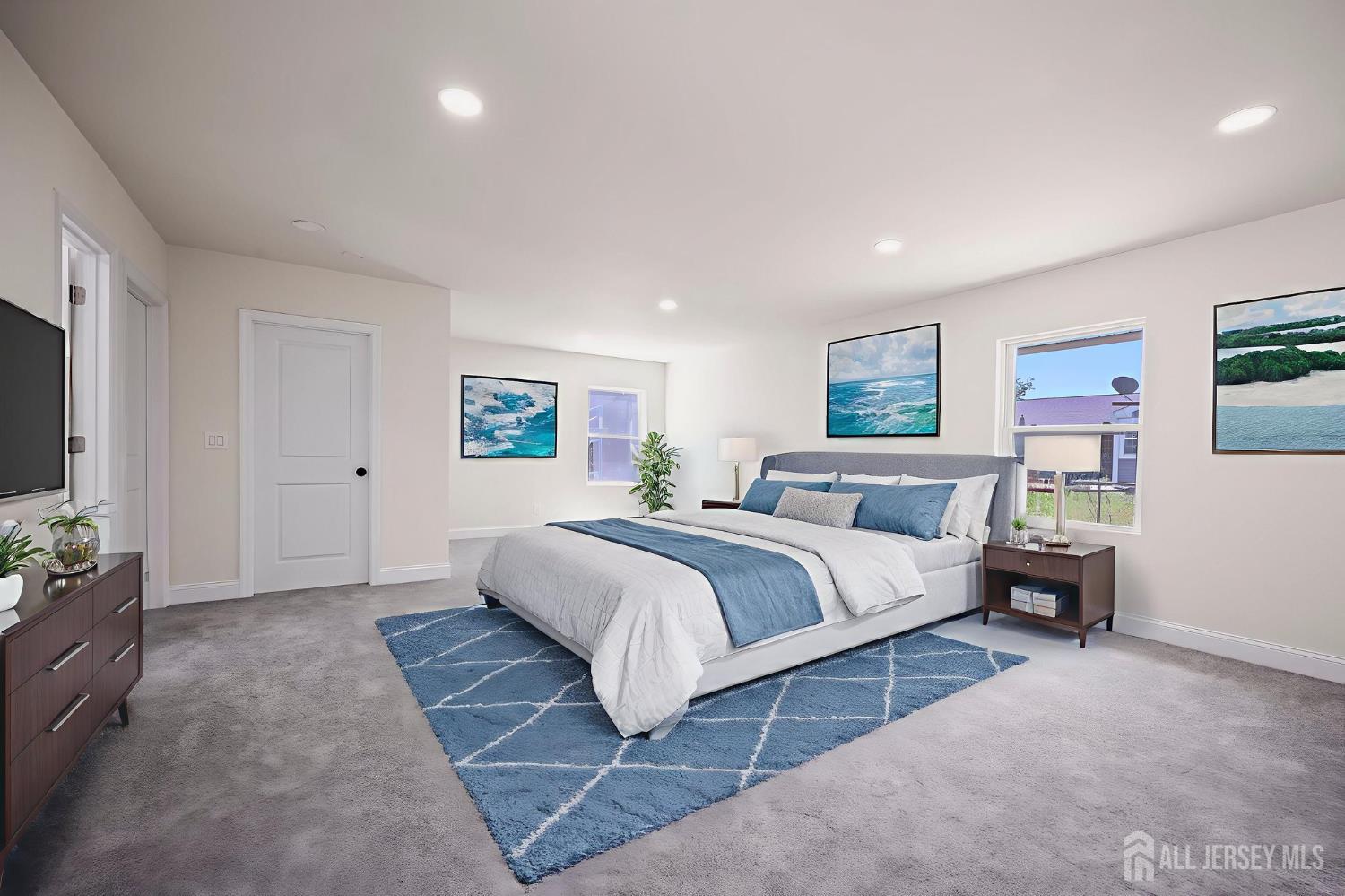 12 Dillon Road Kendall Park, NJ 08824 - Photo 5 of 48 a spacious bedroom with a bed and a flat screen tv