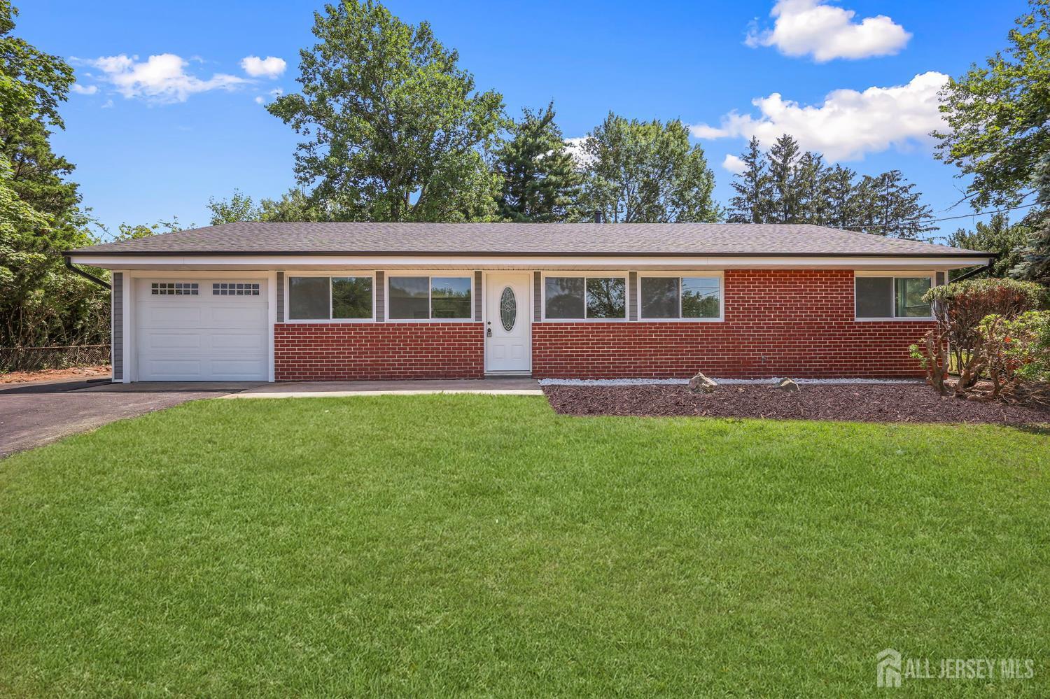 12 Dillon Road Kendall Park, NJ 08824 - Photo 7 of 48 front view of house with a yard