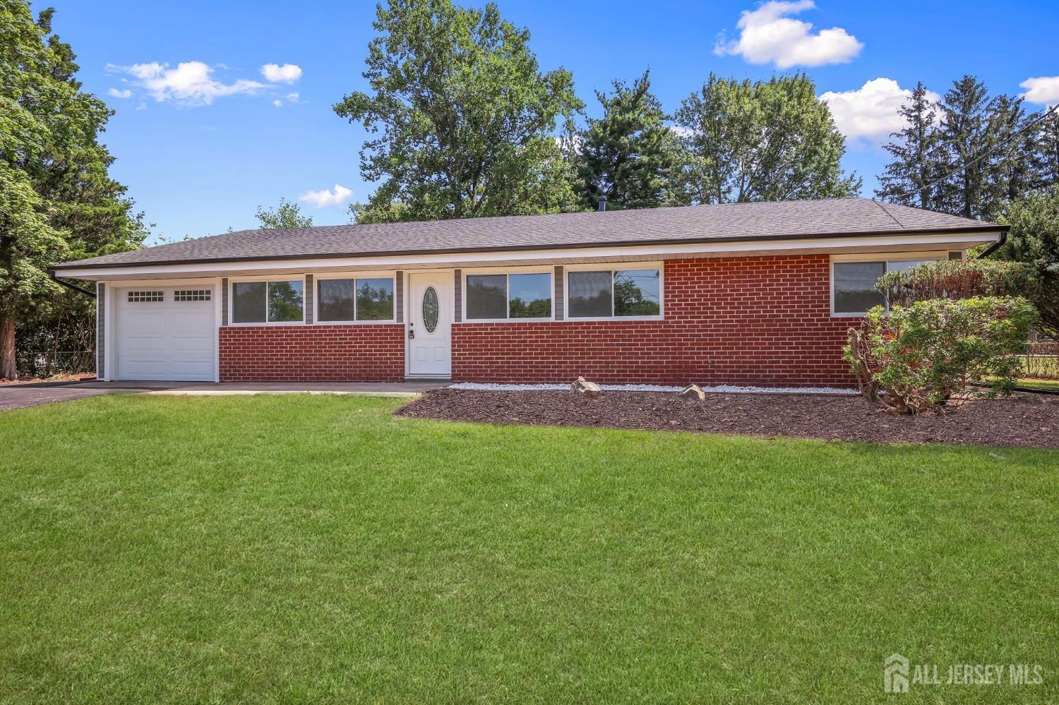 12 Dillon Road Kendall Park, NJ 08824 - Photo 9 of 48 a house view with a garden space